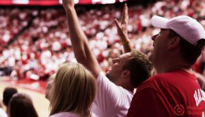 Two Arizona sports betting fans at a basketball game