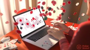 Poker player studying poker at best poker coaching site using his laptop with chips flying around.