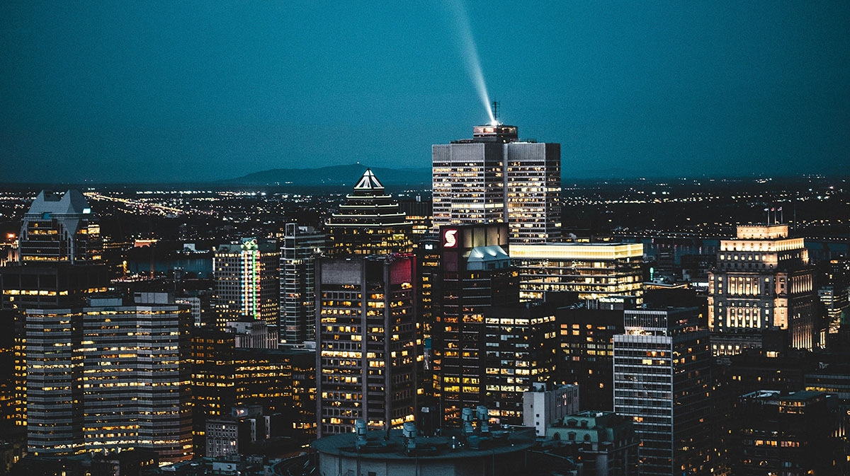 The skyline of downtown Montreal at night, seen from the Mount Royal lookoff.