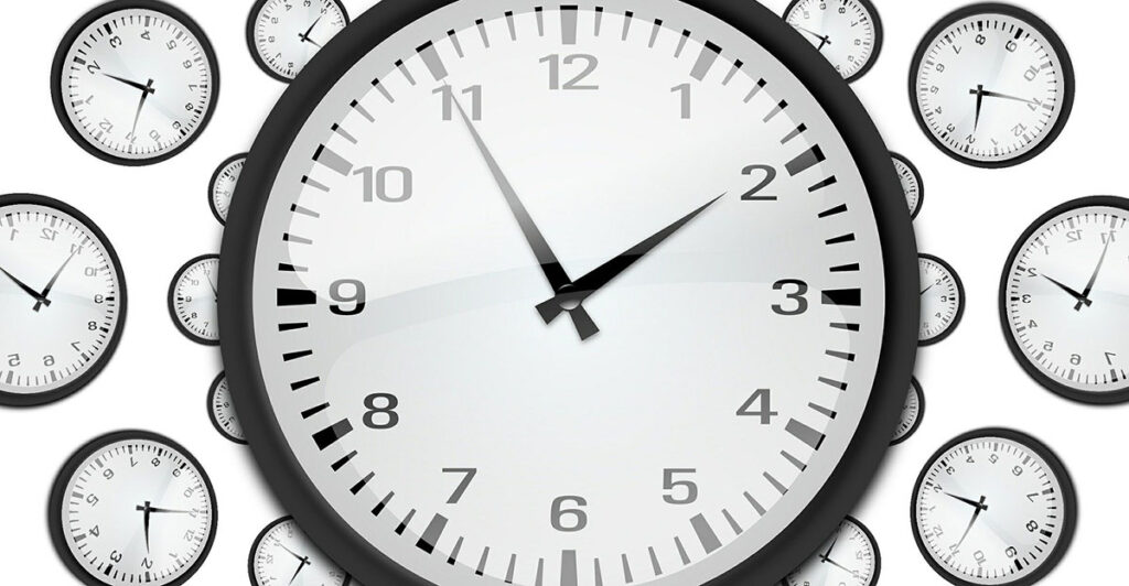 Many clocks white face black hands