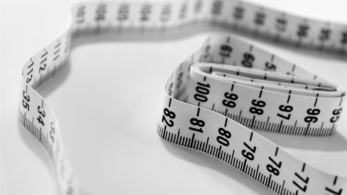 Black and white measuring tape on a white table