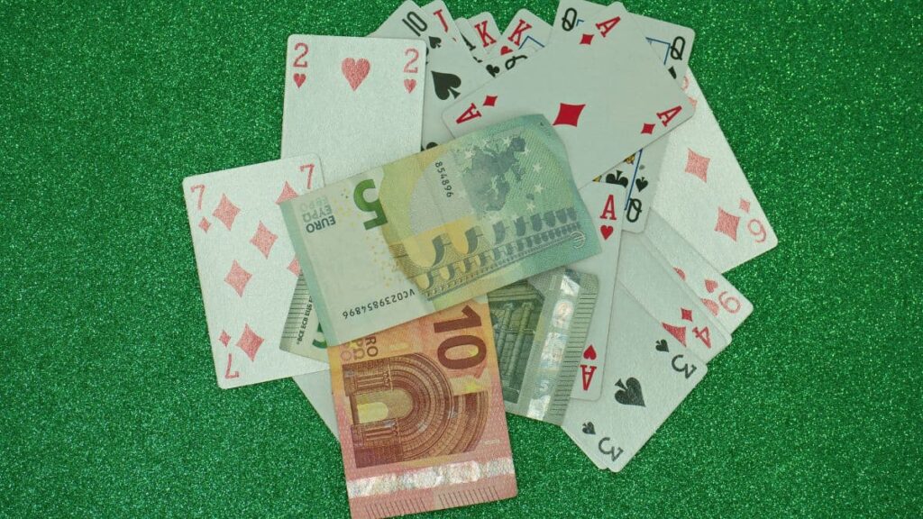 Cash money, Euros and poker cards