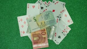 Cash money, Euros and poker cards