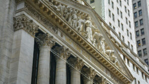Facade with lettering of the New York Stock Exchange building on Wall Street