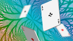 Playing cards tumbling in front of a rainbow fractal background