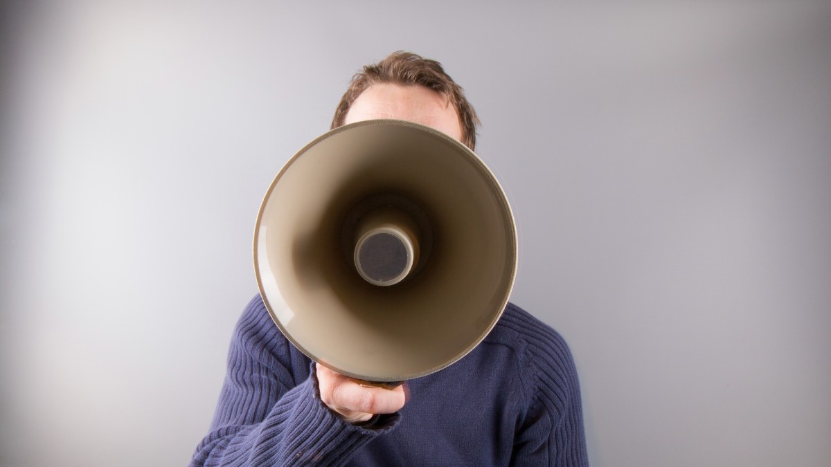 A man with a megaphone.