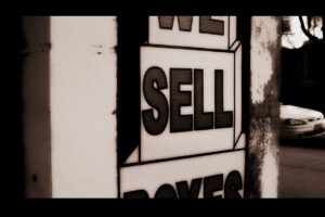 A sign that reads "sell"