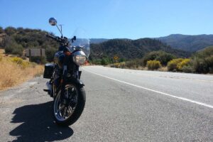 A motorcycle parked on the highway.