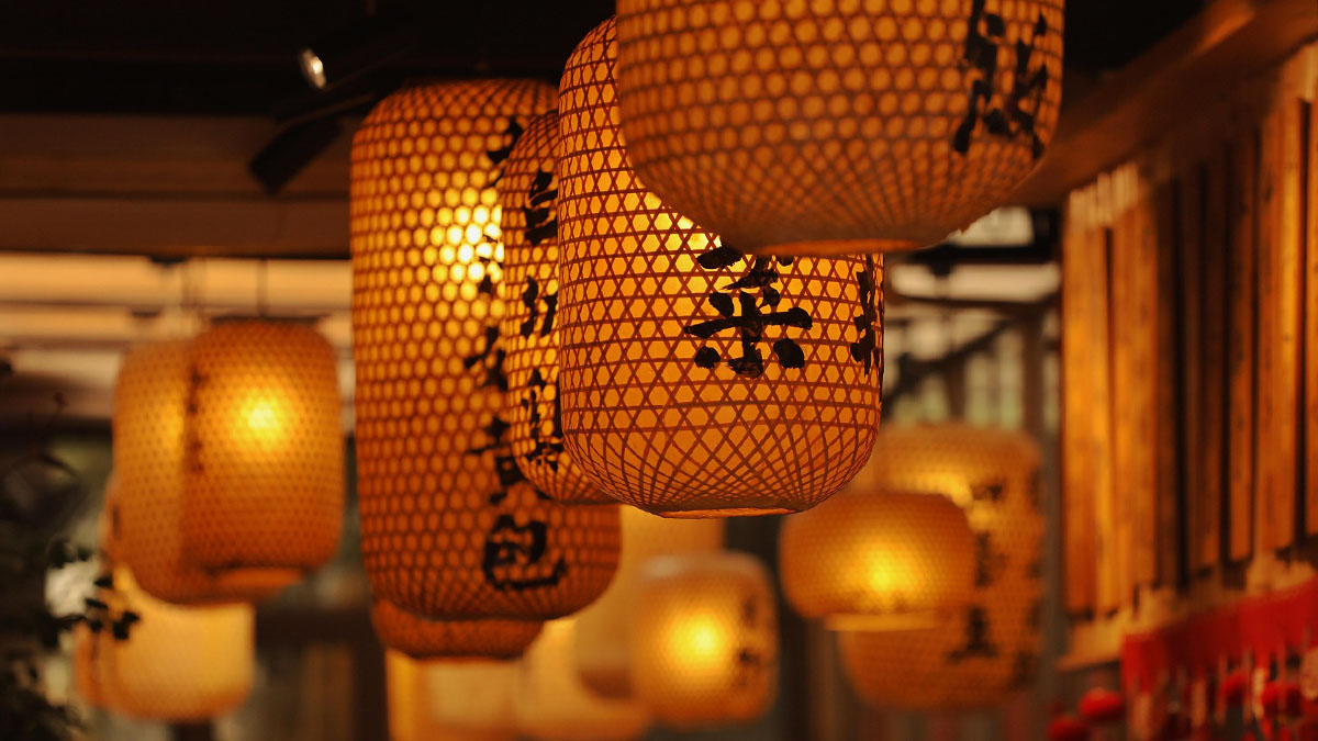 A collection of orange-lit Chinese lanterns.