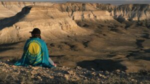 A person with a Kazakhstan flag.