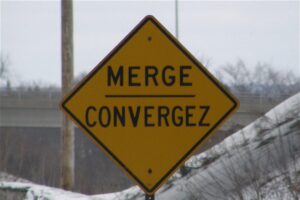 A 'merge' sign on the road.