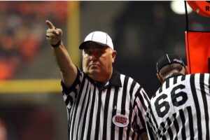 A referee signals a first down