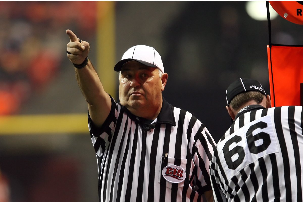 A referee signals a first down