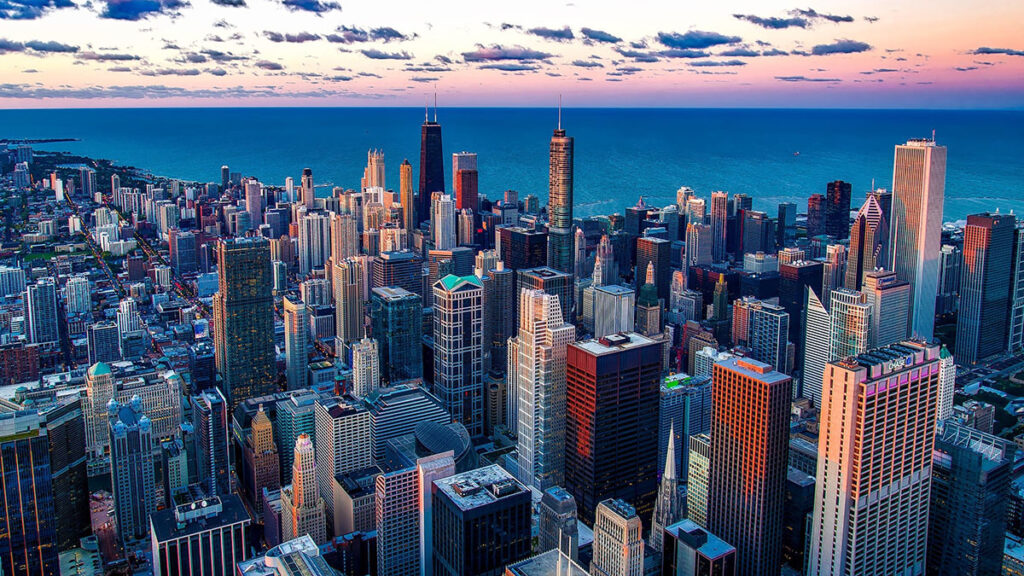 Aerial view of downtown Chicago with Lake Michigan in the background.