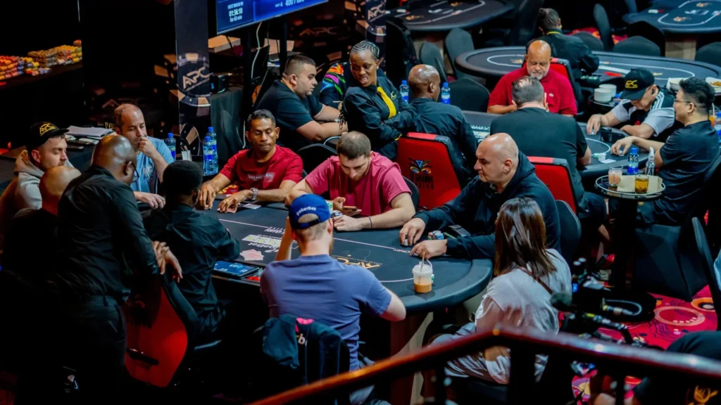 Players competing at a poker table during the African Poker Championship.